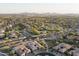 Expansive aerial view showcasing the community's layout and surrounding landscape at 9865 E Piedra Dr, Scottsdale, AZ 85255
