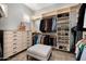 Organized walk-in closet with shelving, drawers, and hanging racks for ample storage space at 9865 E Piedra Dr, Scottsdale, AZ 85255