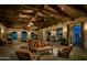 Expansive clubhouse interior with exposed wood beams, ample seating, and outdoor views at 9865 E Piedra Dr, Scottsdale, AZ 85255