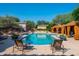Relaxing community pool area with lounge chairs, cabanas, and desert landscaping at 9865 E Piedra Dr, Scottsdale, AZ 85255