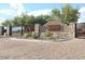 Elegant stone community entrance with signage for Windgate Ranch at 9865 E Piedra Dr, Scottsdale, AZ 85255