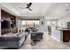Spacious living area featuring comfortable seating, built-in shelving, and a seamless transition to the outdoor patio at 9865 E Piedra Dr, Scottsdale, AZ 85255