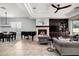 An open living room featuring a fireplace, custom built-ins, and modern furnishings at 9865 E Piedra Dr, Scottsdale, AZ 85255