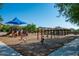 Well-equipped community playground with slides, swings, and covered picnic areas at 9865 E Piedra Dr, Scottsdale, AZ 85255