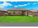 Well maintained green lawn, covered patio with great rear yard access at 10152 E Knowles Ave, Mesa, AZ 85209