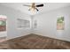 Bright, carpeted bedroom with large windows providing ample natural light at 10152 E Knowles Ave, Mesa, AZ 85209