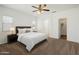 Relaxing bedroom with ceiling fan, plush carpet, and ample natural light at 10152 E Knowles Ave, Mesa, AZ 85209