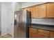 Modern kitchen featuring stainless steel refrigerator, ample cabinet space at 10152 E Knowles Ave, Mesa, AZ 85209