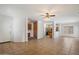 Open-concept living area showcasing tile flooring, a ceiling fan, and easy access to the kitchen at 10152 E Knowles Ave, Mesa, AZ 85209