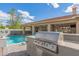 Backyard with a built-in BBQ and a sparkling pool at 104 E Louis Way, Tempe, AZ 85284