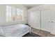 Bedroom featuring a bed with white linens and a large window with shutter at 104 E Louis Way, Tempe, AZ 85284