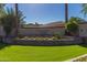 Coventry Tempe community entrance sign with brick wall and lush green landscaping under a sunny sky at 104 E Louis Way, Tempe, AZ 85284