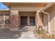Inviting front entry featuring a brick facade, stone walkway, and a stately double door entrance with sidelight windows at 104 E Louis Way, Tempe, AZ 85284