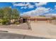 Charming single-story home featuring desert landscaping, a tile roof, and an inviting front facade with lots of curb appeal at 104 E Louis Way, Tempe, AZ 85284