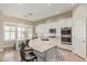 Kitchen featuring a large island, white cabinets, and stainless steel appliances at 104 E Louis Way, Tempe, AZ 85284