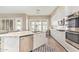 Stylish kitchen with granite countertops, stainless steel appliances, and a functional island, ready for cooking at 104 E Louis Way, Tempe, AZ 85284