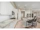 Elegant kitchen with granite countertops, white cabinetry, stainless steel appliances, and ample counter space at 104 E Louis Way, Tempe, AZ 85284