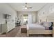 Bright main bedroom with ceiling fan, outdoor access, and a dedicated workspace at 104 E Louis Way, Tempe, AZ 85284