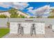 Outdoor bar area with stools and outdoor lighting at 104 E Louis Way, Tempe, AZ 85284