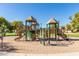 Community playground featuring multiple slides, climbing structures, and play areas for enjoyment and recreation at 104 E Louis Way, Tempe, AZ 85284