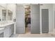 The walk-in closet is spacious, featuring hanging racks and shelving for storage at 104 E Louis Way, Tempe, AZ 85284