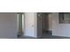 Neutral tones enhance the carpeted hallway featuring multiple doors and easy kitchen access at 11011 N 92Nd St # 1096, Scottsdale, AZ 85260