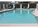 This refreshing community pool is surrounded by ample seating and lush landscaping at 11011 N 92Nd St # 1096, Scottsdale, AZ 85260