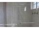 The shower has stylish tile work, sleek glass doors, and chrome fixtures at 11011 N 92Nd St # 1096, Scottsdale, AZ 85260