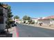 A beautiful street view showcases the community's manicured landscaping and charming architecture at 11011 N 92Nd St # 1096, Scottsdale, AZ 85260