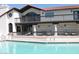 Enjoy the community pool with comfortable lounge chairs on the covered patio at 11011 N 92Nd St # 1096, Scottsdale, AZ 85260