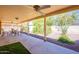 Enjoy outdoor living on this covered patio, complete with ceiling fans and low-maintenance landscaping at 1156 E Brenda Dr, Casa Grande, AZ 85122