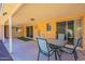 Relax on the covered patio featuring a dining area and access to the backyard at 1156 E Brenda Dr, Casa Grande, AZ 85122