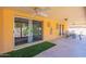 Spacious covered patio boasts a ceiling fan, backyard access, and desert landscaping views at 1156 E Brenda Dr, Casa Grande, AZ 85122
