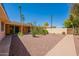 Enjoy the private backyard oasis with desert landscaping and a paved walkway at 1156 E Brenda Dr, Casa Grande, AZ 85122