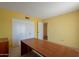 Bedroom featuring a desk, a large closet, and an open doorway at 1156 E Brenda Dr, Casa Grande, AZ 85122