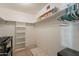Walk-in closet featuring built-in shelving and ample storage space for an organized wardrobe at 1156 E Brenda Dr, Casa Grande, AZ 85122