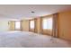 Expansive living room with carpet and multiple large windows providing natural light at 1156 E Brenda Dr, Casa Grande, AZ 85122