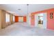 Open living space leads into adjacent kitchen featuring white appliances at 1156 E Brenda Dr, Casa Grande, AZ 85122