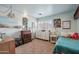Bedroom featuring shiplap, unique lighting, bright windows and decor at 11785 N 143Rd Dr, Surprise, AZ 85379