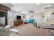 Large bedroom with fireplace, ceiling fan, plantation shutters, and cozy seating at 11785 N 143Rd Dr, Surprise, AZ 85379