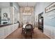 Elegant dining room with high ceilings, chandelier, and wainscoting at 11785 N 143Rd Dr, Surprise, AZ 85379