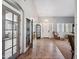 Spacious entryway featuring tile flooring, a chandelier, and french doors at 11785 N 143Rd Dr, Surprise, AZ 85379