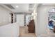Hallway view with carpet floor featuring an office nook and a bedroom with natural light at 11785 N 143Rd Dr, Surprise, AZ 85379