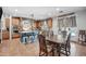 Spacious eat-in kitchen with tile floors, wood cabinets, large island, and views of the pool at 11785 N 143Rd Dr, Surprise, AZ 85379