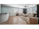 Comfortable living room featuring tile flooring, sofas, and plantation shutters at 11785 N 143Rd Dr, Surprise, AZ 85379