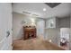 Upstairs loft area featuring a beautiful antique rolltop desk and chair and view of the dining room at 11785 N 143Rd Dr, Surprise, AZ 85379