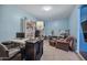 Neutral carpeted room with light blue walls featuring an array of shelving and work desk at 11785 N 143Rd Dr, Surprise, AZ 85379