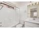 The bright bathroom showcases a white vanity, bath tub and updated fixtures at 12109 N 127Th Dr, El Mirage, AZ 85335