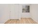 Bedroom featuring a closet, window with blinds, wood-look flooring and neutral paint at 12109 N 127Th Dr, El Mirage, AZ 85335