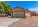 Single-Gathering home featuring a two-car garage and low-maintenance desert landscaping at 12109 N 127Th Dr, El Mirage, AZ 85335